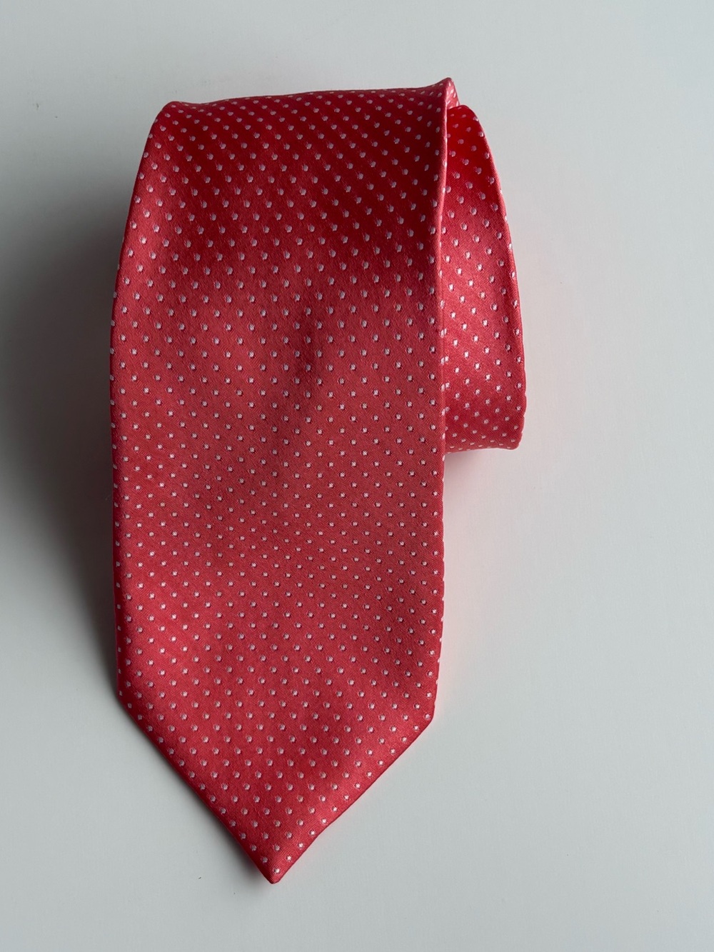 The Tie Bar Men’s Silk Tie. Salmon color with white microdots